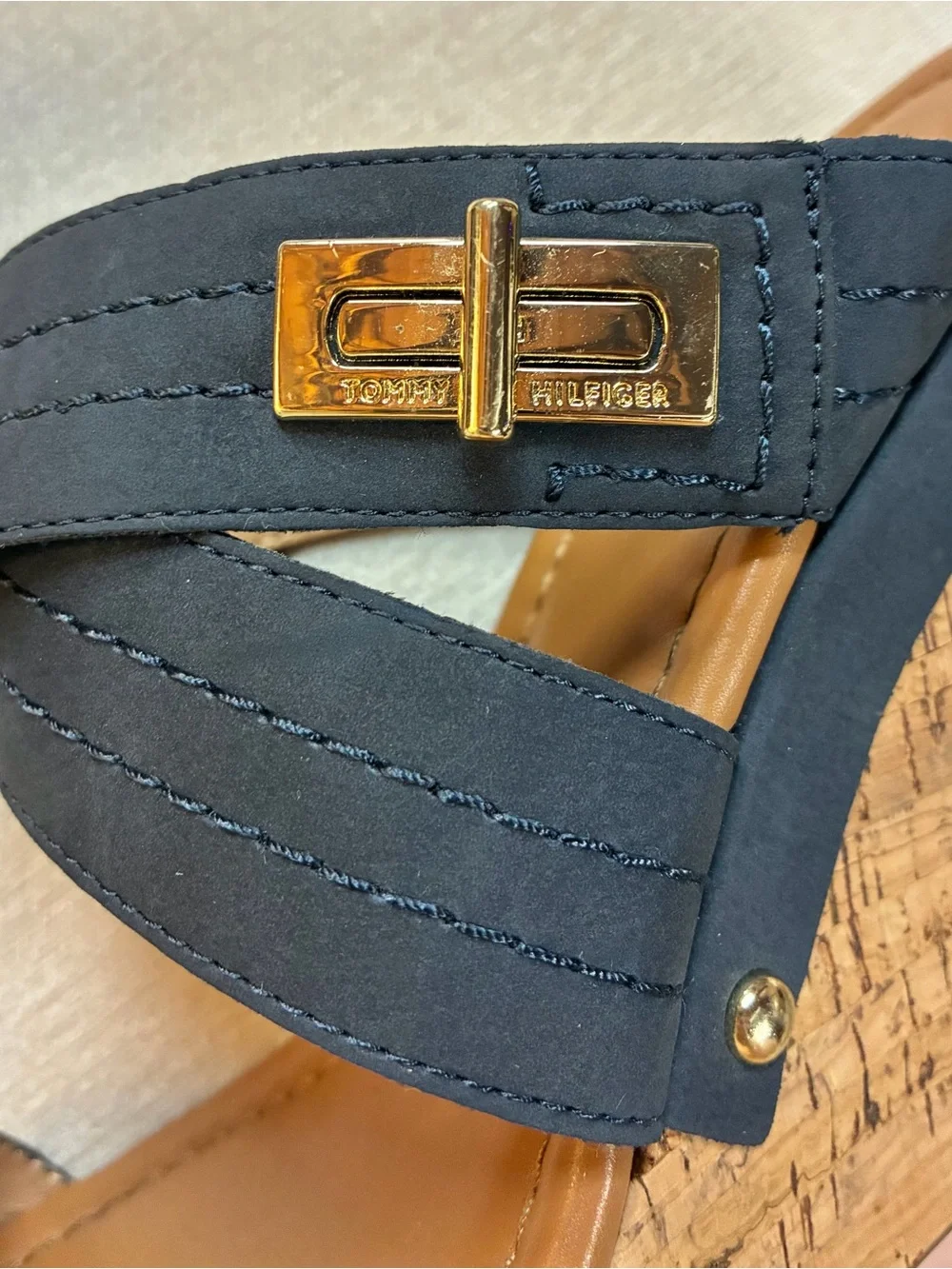 Tommy Hilfiger women’s cork wedge slide sandals with gold-tone logo hardware